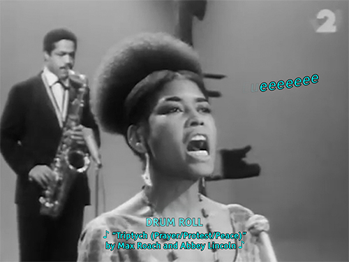 Abbey Lincoln singing at full force, her mouth is open wide